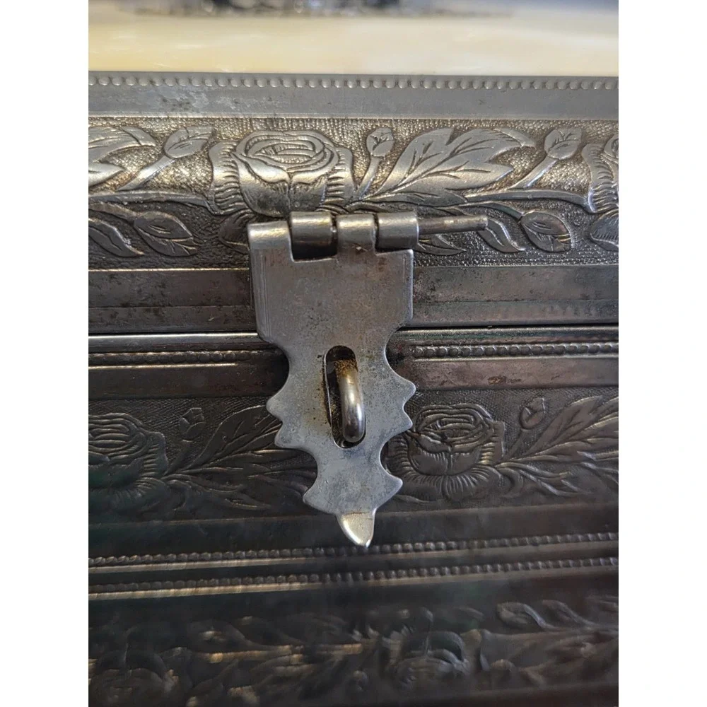 antique etched brass trinket box features a hinged lid Music Box